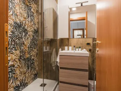 a bathroom with a sink and a mirror at The Best Rent - Three-bedroom apartment near the Quirinale in Rome