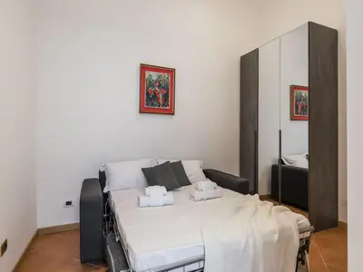 a bedroom with a bed in a room at The Best Rent - Three-bedroom apartment near the Quirinale in Rome