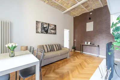a living room with a couch and a table at Charming Vatican Apartment in Rome