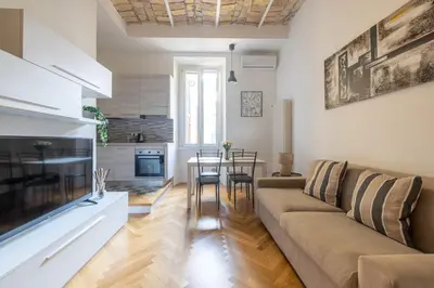 a living room with a couch and a table at Charming Vatican Apartment in Rome