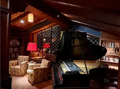 a room with a bed and a couch and a chair at CHALET MARMONT ROME in Rome