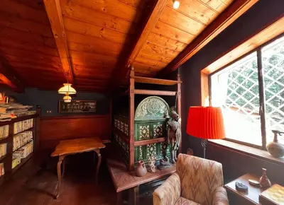 a room with a table and a chair and a lamp at CHALET MARMONT ROME in Rome