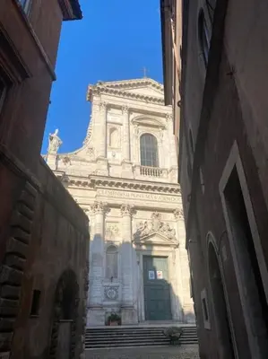 a large building with a large door in a street at Domus Paolina in Rome