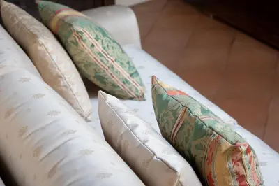a group of pillows on a couch at Amazing Fontana di Trevi in Rome