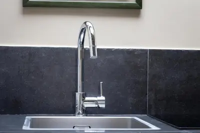 a kitchen sink with a faucet on a counter at Amazing Fontana di Trevi in Rome
