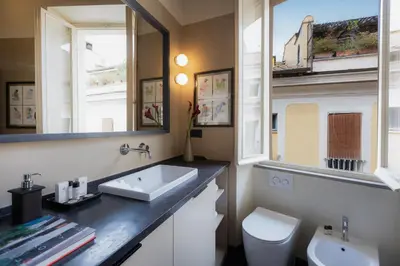 a bathroom with a sink and a toilet at Amazing Fontana di Trevi in Rome