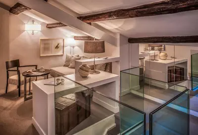 a room with glass shelves and a couch and a table at 47LuxurySuites - Trevi in Rome