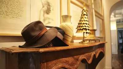 a hat sitting on top of a table at 47LuxurySuites - Trevi in Rome