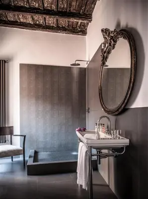a bathroom with a sink and a mirror at 47LuxurySuites - Trevi in Rome
