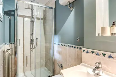 a bathroom with a shower and a sink at Vicolo leopardo suite Trastevere in Rome