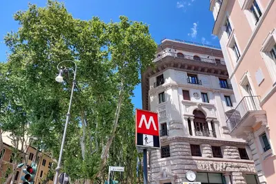 a sign on a pole in front of a building at Trevi Feddy's Apartment in Rome