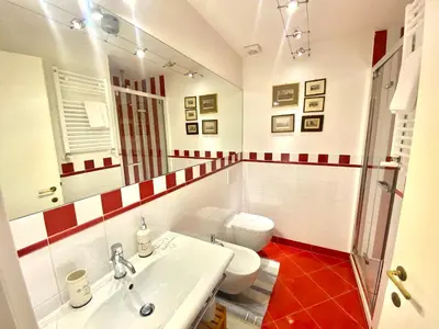 a bathroom with a sink and a toilet at Quirinale Suite Fontane in Rome