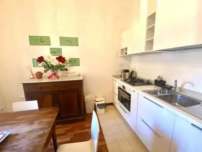 a kitchen with a sink and a stove top oven at Quirinale Suite Fontane in Rome