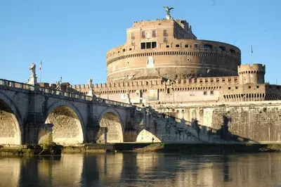 a bridge over a river with a building at Casina Roma, 2 min to Piazza Navona in Rome