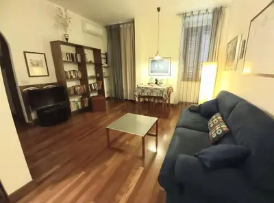 a living room with a couch and a table at la casa del viaggiante in Rome