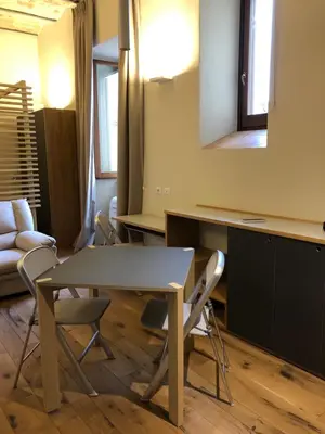 a dining room with a table and chairs in a room at All'antico molino in Rome