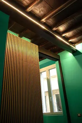 a room with a green wall and a window at Riad Campo de' Fiori in Rome