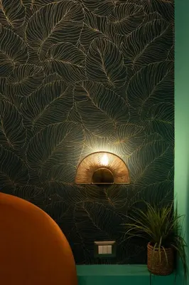 a wall with a mural of leaves on a wall at Riad Campo de' Fiori in Rome