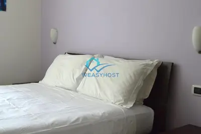 a bedroom with a weddworst pillow on a bed at Your Roman Retreat near San Giovanni in Rome