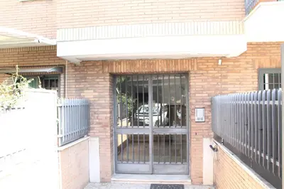 a brick building with a door with bars on it at Capital House Roma in Rome