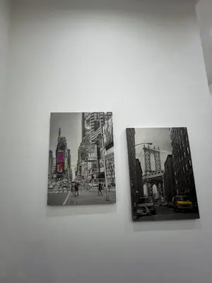 three photographs of a city on a wall at FRALE Home in Rome in Rome