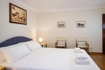 a bedroom with a bed with towels on it at Peaceful apartment in piazza Venezia's alleys in Rome