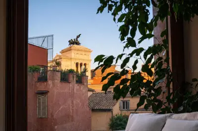 a living room with two red couches and a coffee table at Peaceful apartment in piazza Venezia's alleys in Rome