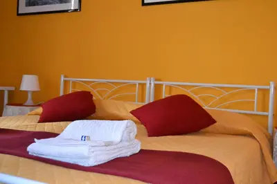 a bedroom with two beds with towels on them at LunaBed Roma - Affitti brevi in Rome