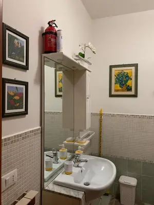 a bathroom with a sink and a mirror at LunaBed Roma - Affitti brevi in Rome