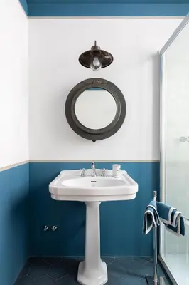 a bathroom with a sink and a mirror at Popolo Charming Apartment in Rome