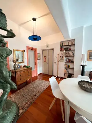 a living room with a table and a dining room at Living in Vatican City in Rome
