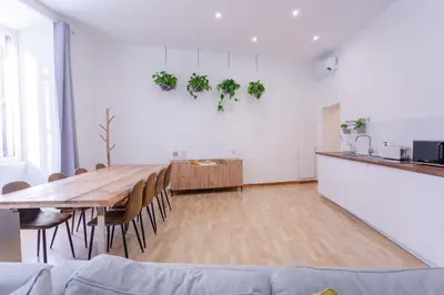 a kitchen and dining room with a table and chairs at APT Rome 5 BDRMs in Rome
