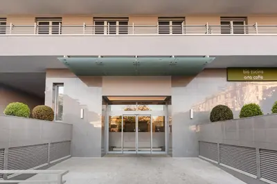 an external view of a building with a revolving door at Trastevere Contemporary Apartment in Rome