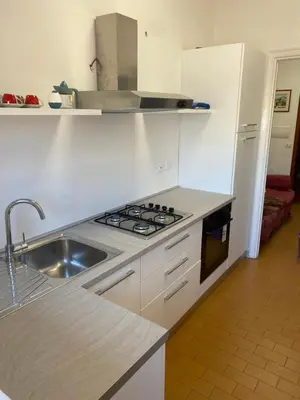 a kitchen with a sink and a stove at Nic Roma House in Rome