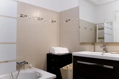 a bathroom with a sink and a mirror at Domus Oriana in Rome