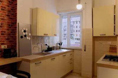 a small kitchen with a sink and a window at Domus Oriana in Rome