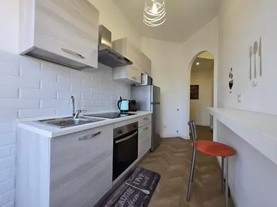a kitchen with a sink and a counter top at Trastevere Dreamer Home Rome in Rome