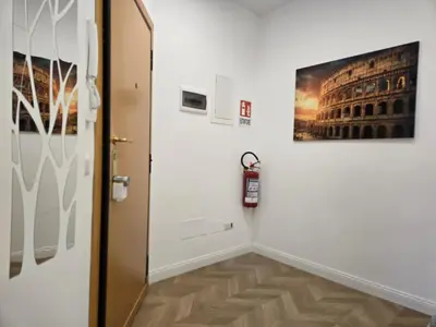 a hallway with a door and a painting on the wall at Trastevere Dreamer Home Rome in Rome