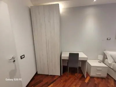 a small room with a desk and a bed at Vatican house 98 in Rome