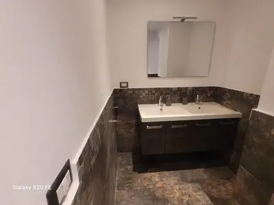 a bathroom with a sink and a mirror at Vatican house 98 in Rome