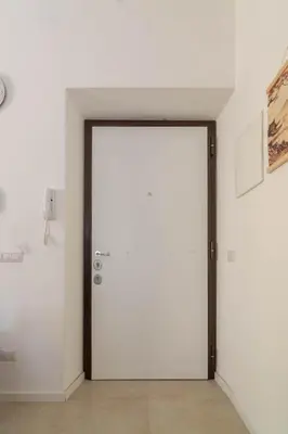 an open door in a room with white walls at Domus Eroi in Rome