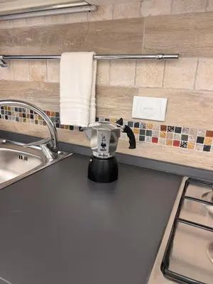 a tea pot sitting on a counter in a kitchen at IMPERIUM INN in Rome
