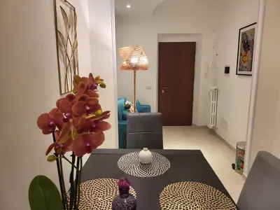 a living room with a table and a couch at Vatican Tolemaide 2 Suites 2 Bagni in Rome
