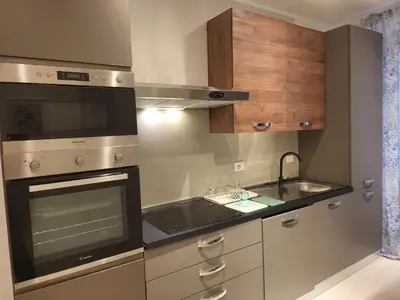 a kitchen with a sink and a stove top oven at Vatican Tolemaide 2 Suites 2 Bagni in Rome
