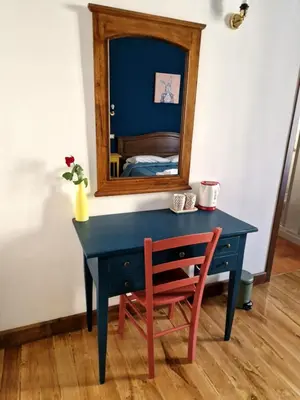 a blue desk with a chair and a mirror at Pepe's Place - Carlo Alberto in Rome