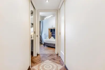a hallway leading to a bedroom with a bed at Luxury Giorgi Home in Rome
