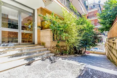 a house with stairs outside of a building at Luxury Giorgi Home in Rome