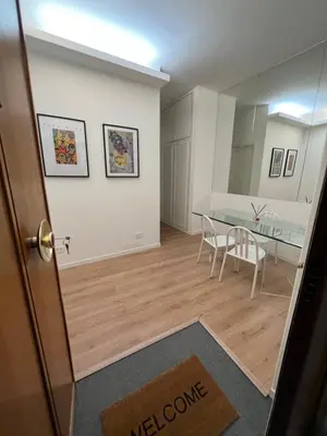 a room with a table and a dining room at Luxury Suite Rialto in Rome