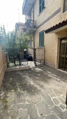 a building with a gate in front of a building at MARAND HOUSE ROME in Rome