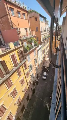 a view from a window of a street with buildings at Romerooms Condotti in Rome